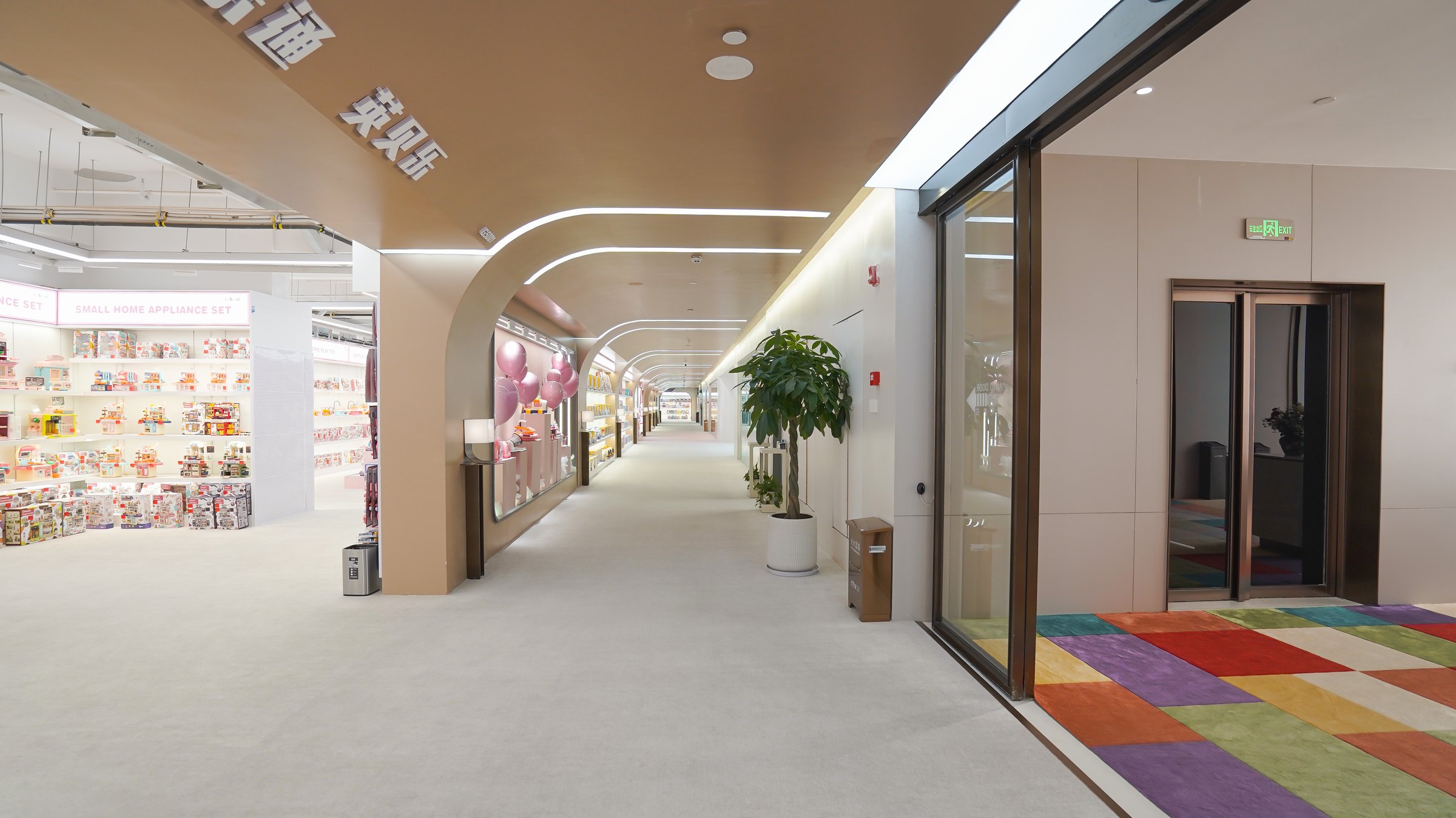 Showroom corridor with toy displays and retail presentation areas